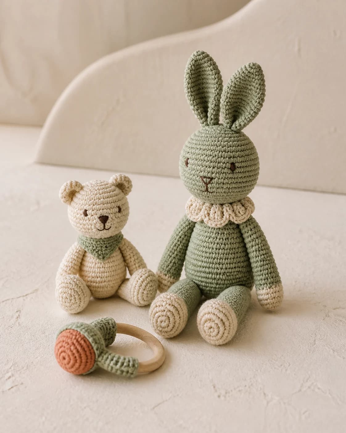 Coordinated crochet baby toys and a ring rattle